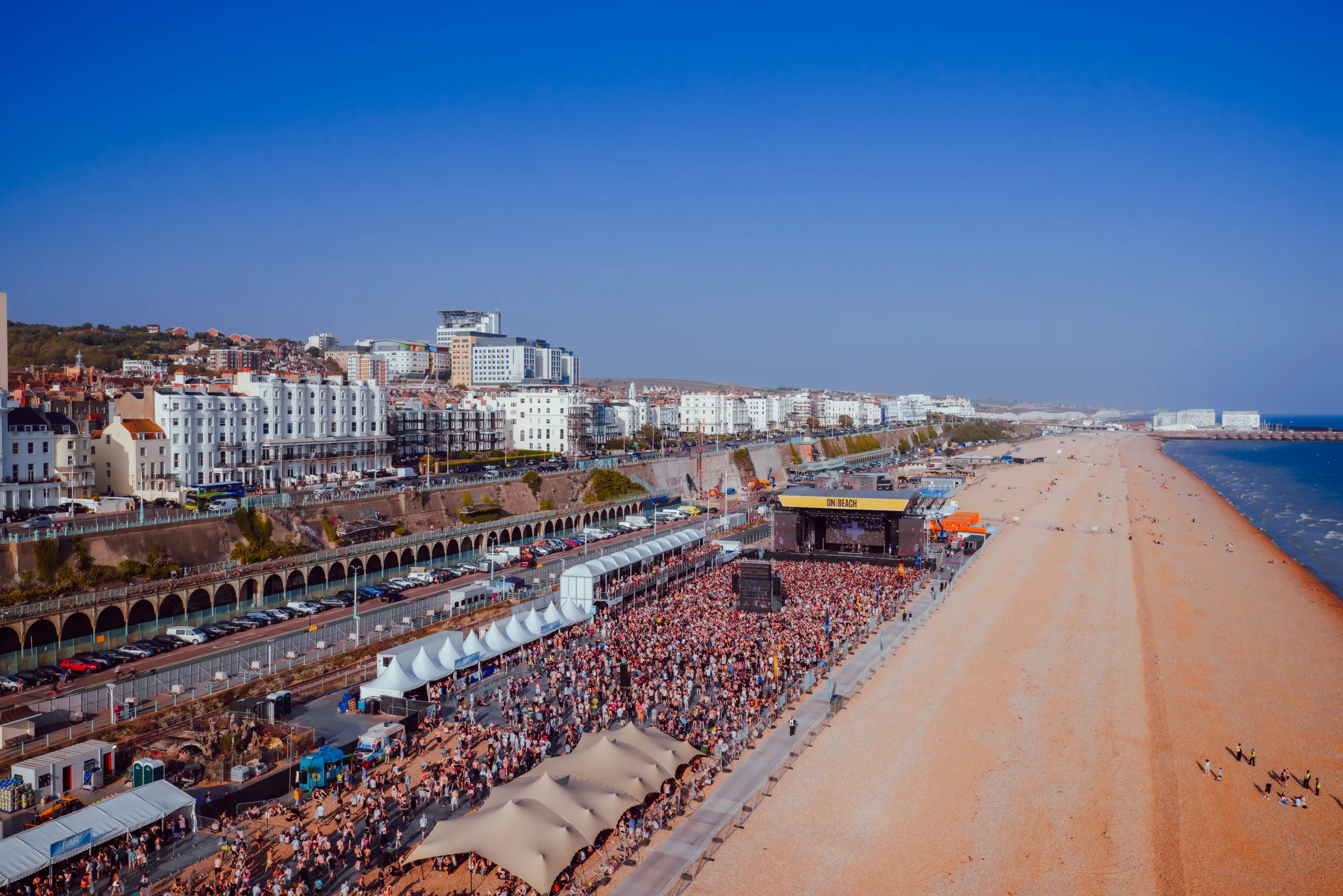 Aerial view of On The Beach Brighton festival on the seafront